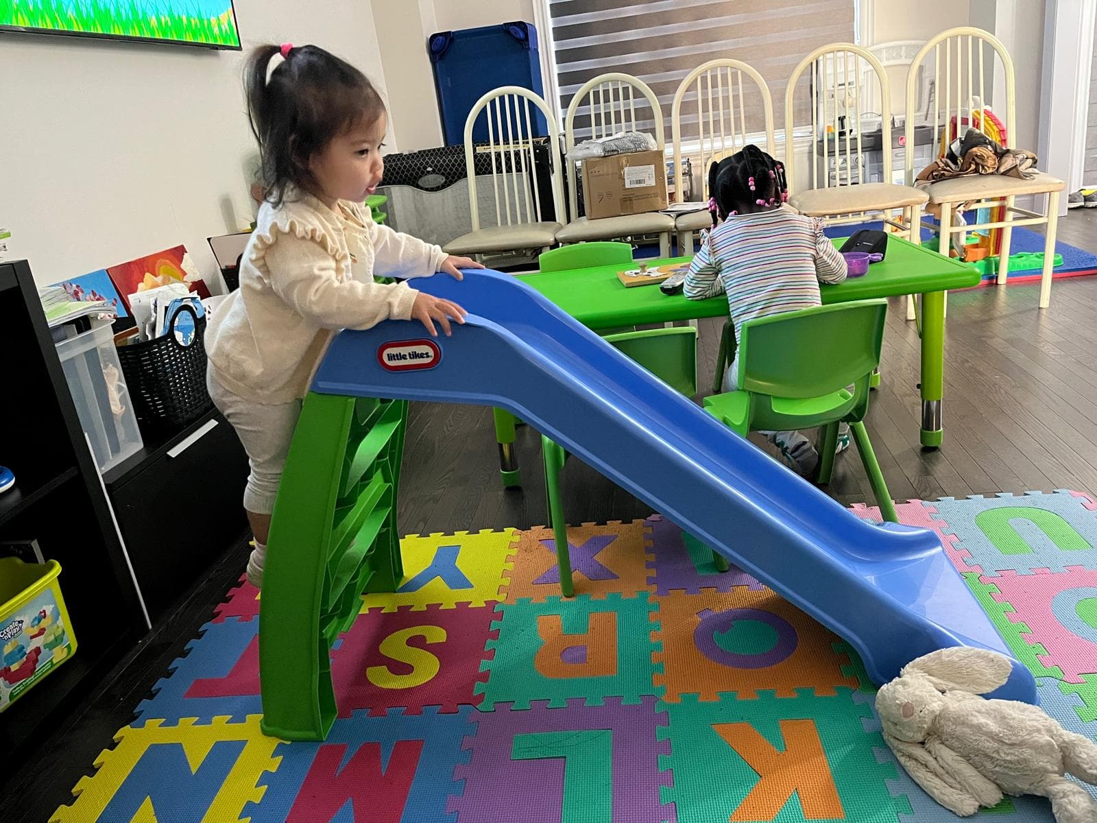 1 infant sliding down slide