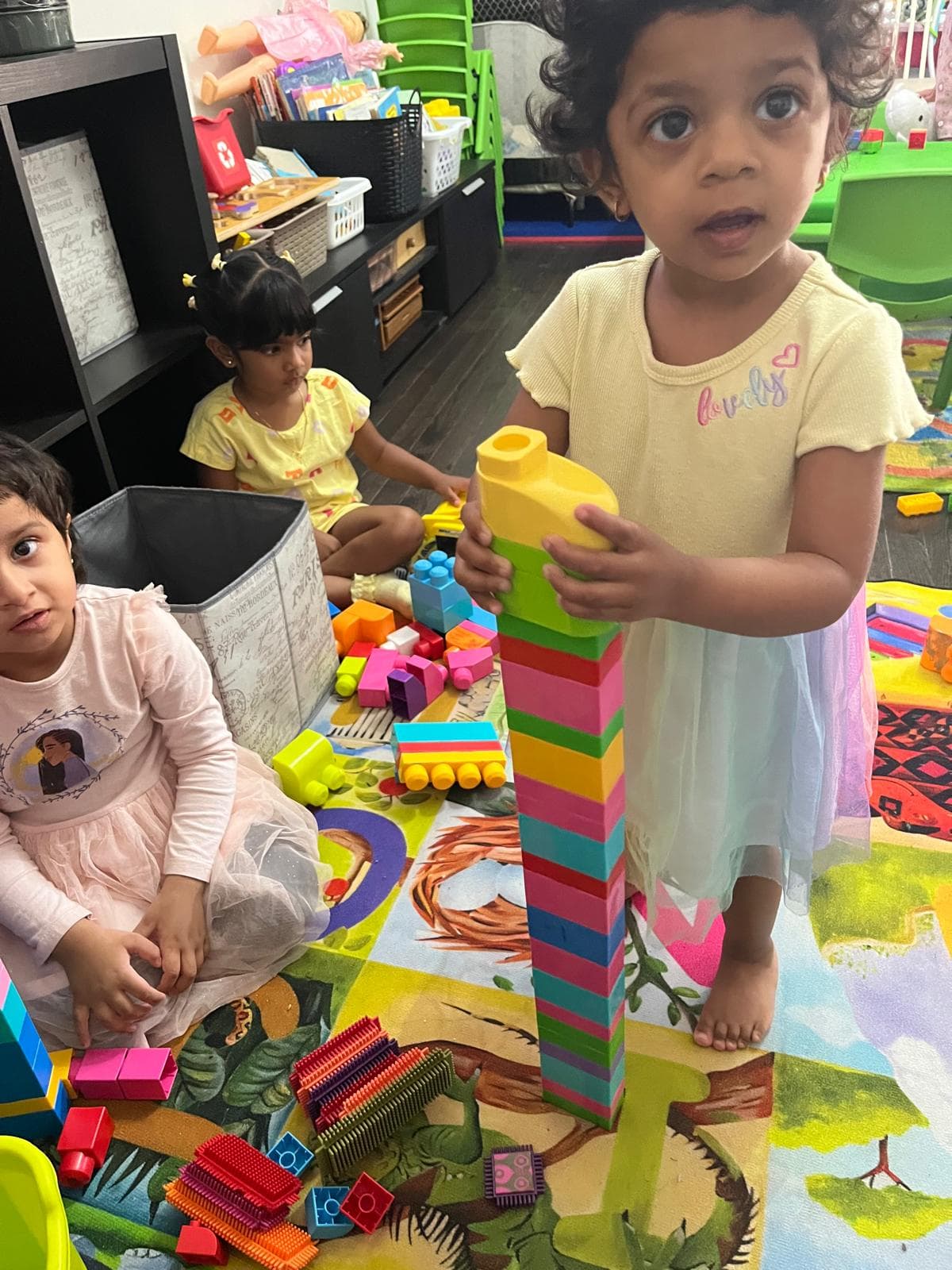 1 kid making a block tower