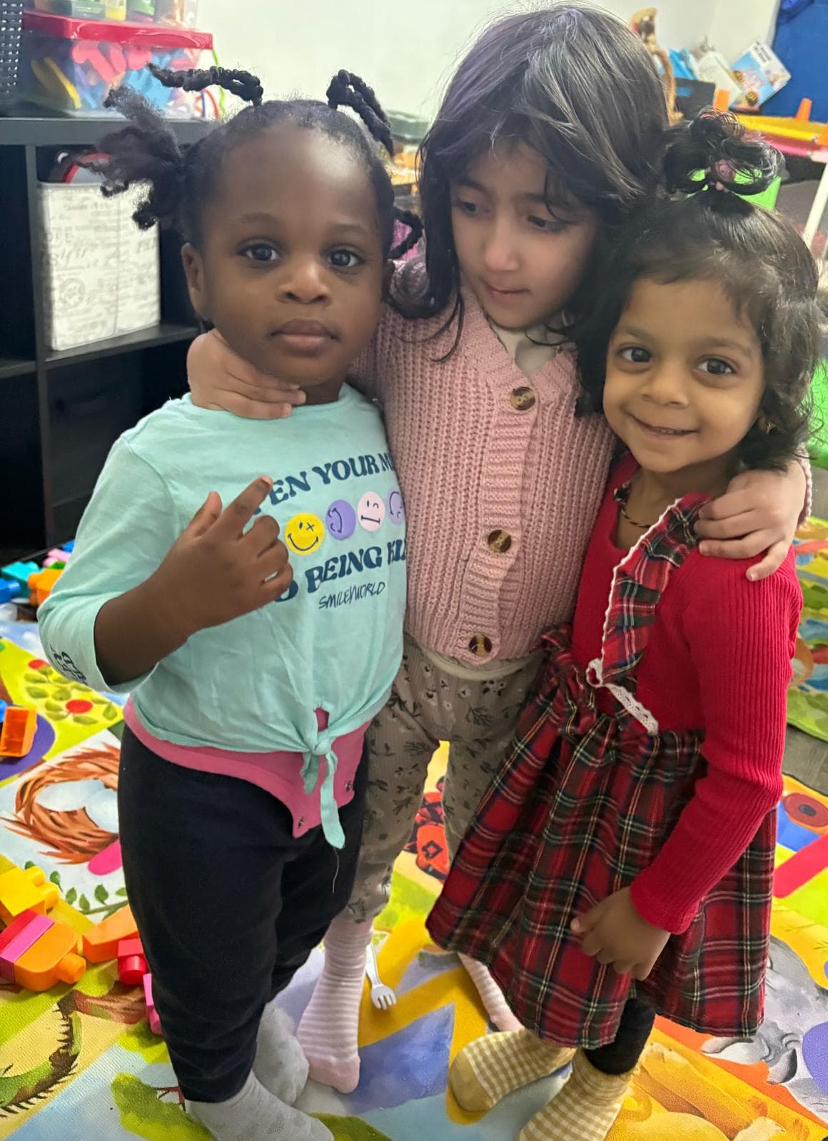 3 girls hugging and smiling for the camera