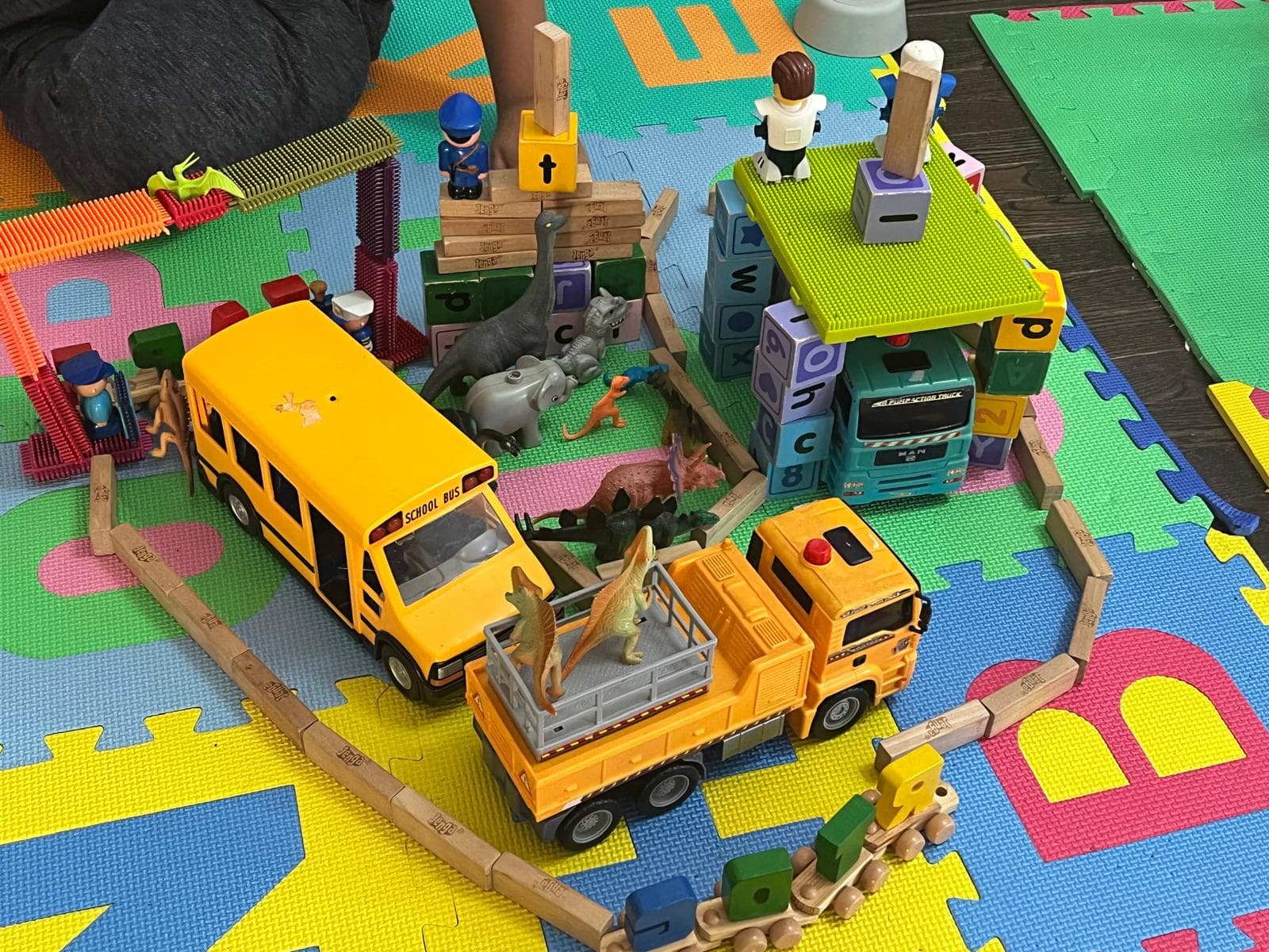 Dinosaur attacking fort build by kids