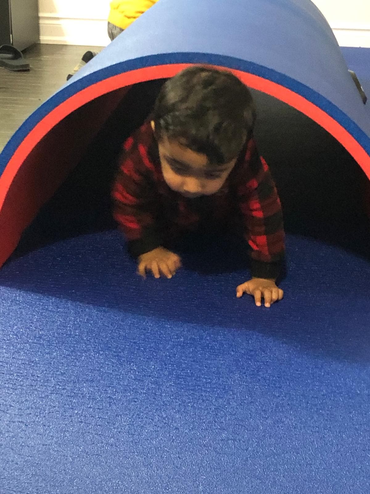Kid crawling through tunnel